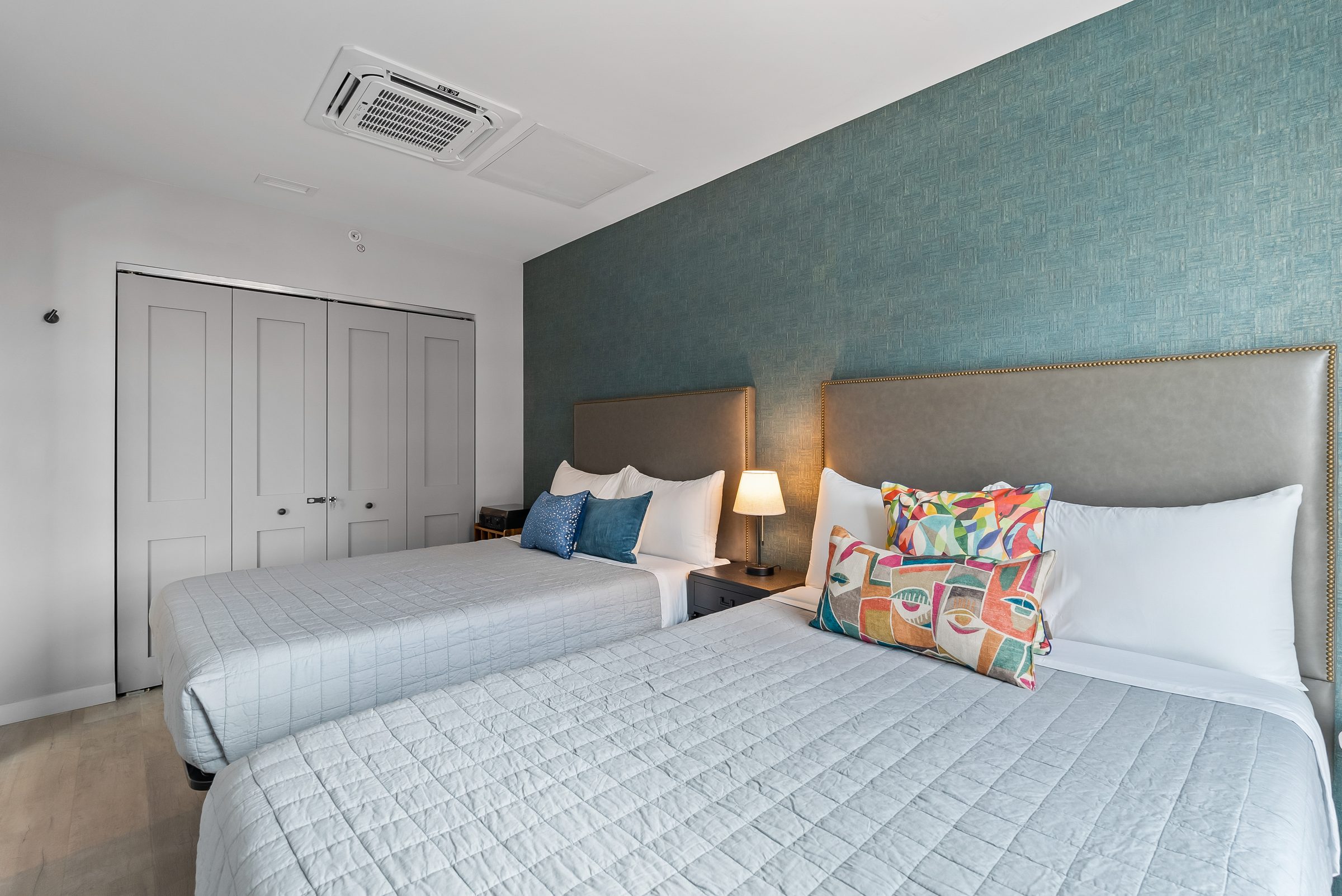 King master bedroom with historic exposed brick accents in private Ybor City suite